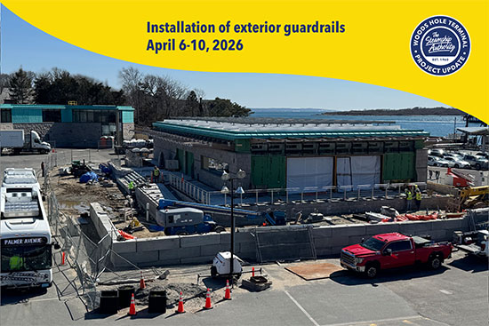 Construction site with a partially built building, equipment, and vehicles; signage announces exterior guardrail installation in April 2026.